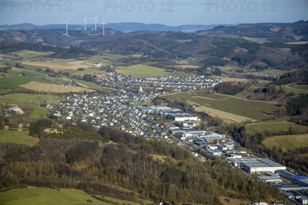 Aerial view, Elspe commercial area with residential area and village view with catholic church St. St James the Elder, forest and hilly landscape, Elspe, Lennestadt, Sauerland, North Rhine-Westphalia, Germany, place of worship, DE, Europe, commercial enterprises, commercial area, commercial property, commercial site, commercial use, religious community, place of worship, property tax, holy site, real estate, industrial site, church, parish, denomination, aerial view, aerial photography, aerial photography, religion, religious site, overview, bird's-eye view, residential area, residential area and living, residential quality, residential neighbourhood, residential estate, residential district, birds-eyes view, overview