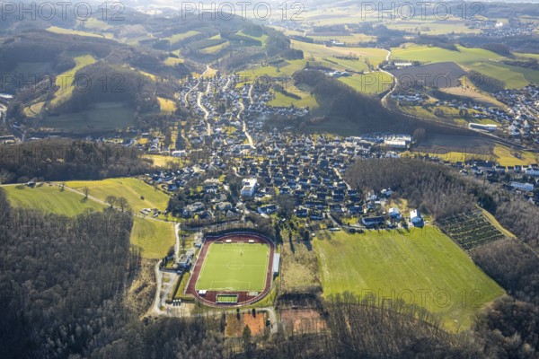 Aerial view, Stadion an der Habuche, football stadium and athletics stadium with residential area, Grevenbrück, Lennestadt, Sauerland, North Rhine-Westphalia, Germany, DE, Europe, property tax, real estate, aerial view, aerial photography, aerial photography, overview, bird's-eye view, residential complex, living and life, residential area, quality of life, residential neighbourhood, housing estate, residential district, bird's-eye view, overview