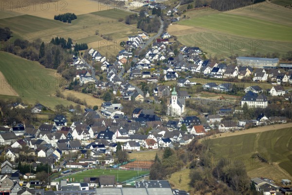 Aerial view, residential area and village view with catholic church St. Jakobus der Ältere in Elspe, Lennestadt, Sauerland, North Rhine-Westphalia, Germany, place of worship, DE, Europe, religious community, place of worship, property tax, holy site, real estate, church, parish, denomination, aerial view, aerial photography, aerial photography, religion, religious site, overview, bird's-eye view, residential area, living and life, residential area, residential quality, residential neighbourhood, housing estate, residential area, birds-eyes view, overview