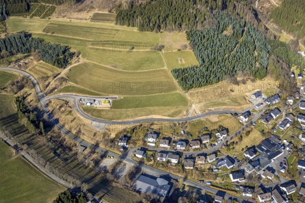Aerial view, construction site with new road construction Am Hesternberg, meadows and fields with hilly landscape, Oberhundem, Kirchhundem, Sauerland, North Rhine-Westphalia, Germany, construction work, construction area, building site, building plots, construction project, construction site, DE, Europe, aerial view, aerial photography, aerial photography, overview, bird's-eye view, bird's-eye view, overview