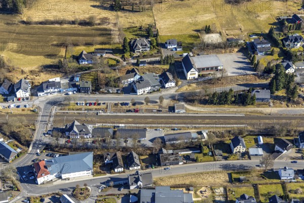 Aerial view, half-timbered station building Kirchhundem-Welschen Ennest railway station, tracks and level crossing, Welschen Ennest, Kirchhundem, Sauerland, North Rhine-Westphalia, Germany, DE, Europe, aerial view, aerial photography, aerial photography, overview, bird's-eye view, bird's-eye view, overview