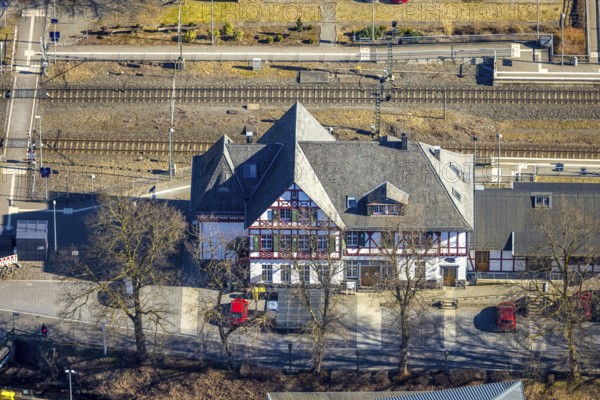 Aerial view, half-timbered station building Kirchhundem-Welschen Ennest railway station, tracks and level crossing, Welschen Ennest, Kirchhundem, Sauerland, North Rhine-Westphalia, Germany, DE, Europe, aerial view, aerial photography, aerial photography, overview, bird's-eye view, bird's-eye view, overview