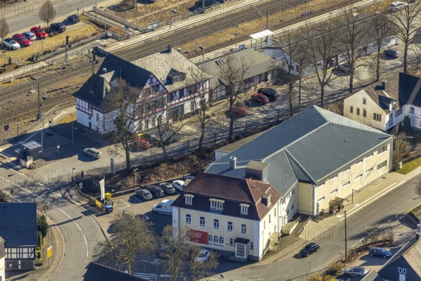 Aerial view, half-timbered station building Kirchhundem-Welschen Ennest railway station, tracks and level crossing, Welschen Ennest, Kirchhundem, Sauerland, North Rhine-Westphalia, Germany, DE, Europe, aerial view, aerial photography, aerial photography, overview, bird's-eye view, bird's-eye view, overview