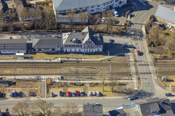 Aerial view, half-timbered station building Kirchhundem-Welschen Ennest railway station, tracks and level crossing, Welschen Ennest, Kirchhundem, Sauerland, North Rhine-Westphalia, Germany, DE, Europe, aerial view, aerial photography, aerial photography, overview, bird's-eye view, bird's-eye view, overview