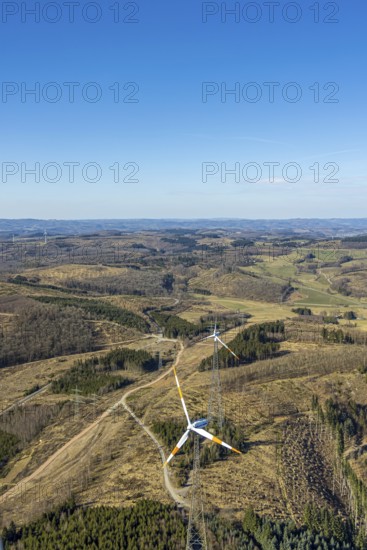 Aerial photo, wind turbines and forest area with forest damage, blue sky with distant view, Burgholdinghausen, Kreuztal, Sauerland, North Rhine-Westphalia, Germany, alternative energy, DE, Europe, Kirchhundem, aerial photo, aerial photography, aerial photography, overview, bird's-eye view, WEA, wind energy, wind power, wind turbine, wind wheel, wind turbines, birds-eyes view, overview