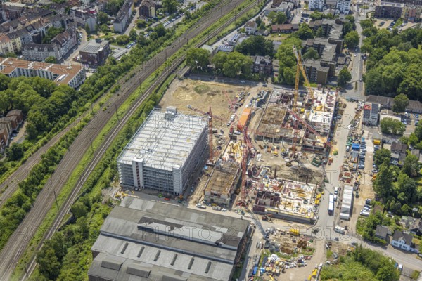 Aerial view, construction site and demolition work for new FunkenbergQuartier between Baumstraße and Fabrikstraße, Baukau, Herne, Ruhr area, North Rhine-Westphalia, Germany, demolition work, workers, architecture, construction work, construction vehicles, construction area, construction site, building plots, construction measure, Baumstraße, construction project, construction site, DE, development, renewal, Europe, Fabrikstraße, progress, Funkenbergquartier, building, site, commercial enterprises, commercial area, commercial area, commercial property, commercial park, commercial site, commercial use, industrial area, industrial site, infrastructure, construction, construction technology, cranes, landscape, aerial view, aerial photography, aerial photography, machinery, modernisation, new construction, planning, projects, redevelopment, city, roads, structure, urban, technology, overview, urban, change, bird's-eye view, destruction, birds-eyes view, overview, HernerechtsderA43