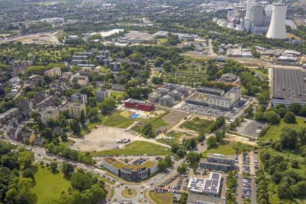 Aerial view, Kaiserquartier Herne, construction site with new residential buildings, community primary school Schule am Schloss with red facade and roof with solar panels, Baukau, Herne, Ruhr area, North Rhine-Westphalia, Germany, construction work, construction area, building site, building plots, construction project, construction site, DE, Europe, aerial view, aerial photography, aerial photography, new building, overview, bird's-eye view, overview, HernerechtsderA43