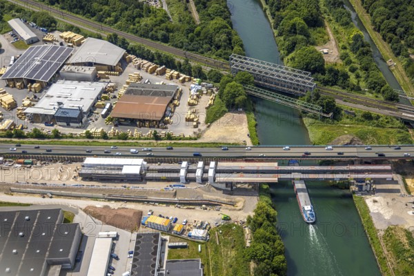 Aerial view, construction site with new construction, railway bridge Emscherbrücke Rollbahn, motorway A43 with bridge over Rhine-Herne Canal, Baukau, Herne, Ruhr area, North Rhine-Westphalia, Germany, A43, architecture, motorway, construction work, construction area, construction site, construction sites, Baukau-West, construction measure, construction project, construction site, construction site vehicles, bridge, bridge construction, DE, railway bridge, Emscherbrücke, Europe, river, water, large construction site, industry, industrial site, infrastructure, infrastructure project, canal, construction, landscape, aerial view, aerial photography, aerial photography, metal processing, Rhine-Herne Canal, runway, Ruhr area scene, rail, sinter works, city, road, transport, overview, urban, traffic, bird's-eye view, birds-eyes view, modern architecture, overview, linksderA43, HernelinksderA43