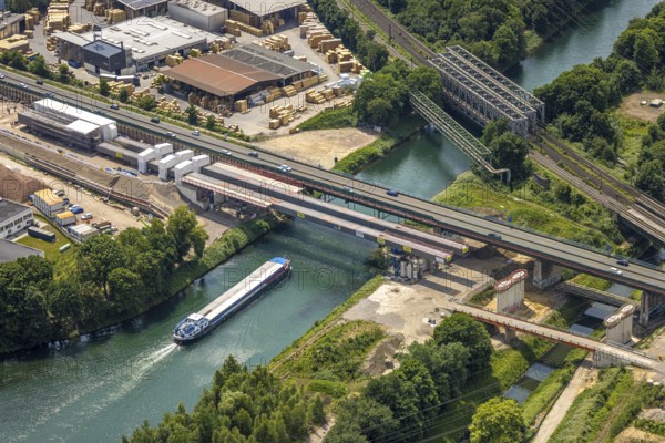 Aerial view, construction site with new construction, railway bridge Emscherbrücke Rollbahn, motorway A43 with bridge over Rhine-Herne Canal, Baukau, Herne, Ruhr area, North Rhine-Westphalia, Germany, A43, architecture, motorway, construction work, construction area, construction site, construction sites, Baukau-West, construction measure, construction project, construction site, construction site vehicles, bridge, bridge construction, DE, railway bridge, Emscherbrücke, Europe, river, water, large construction site, industry, industrial site, infrastructure, infrastructure project, canal, construction, landscape, aerial view, aerial photography, aerial photography, metal processing, Rhine-Herne Canal, runway, Ruhr area scene, rail, sinter works, city, road, transport, overview, urban, traffic, bird's-eye view, birds-eyes view, modern architecture, overview, linksderA43, HernelinksderA43