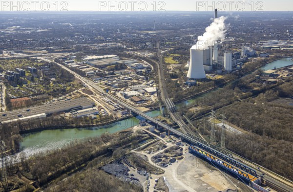 Aerial view, Rhine-Herne Canal, STEAG cogeneration plant Herne and cooling tower with steam cloud, Emscherbrücke Rollbahn (Wanne-Eickel - Hamburg), motorway bridge A43, Baukau, Herne, Ruhr area, North Rhine-Westphalia, Germany, bridge, DE, Europe, canal, power plant, aerial view, aerial photography, aerial photography, overview, bird's-eye view, bird's-eye view, overview