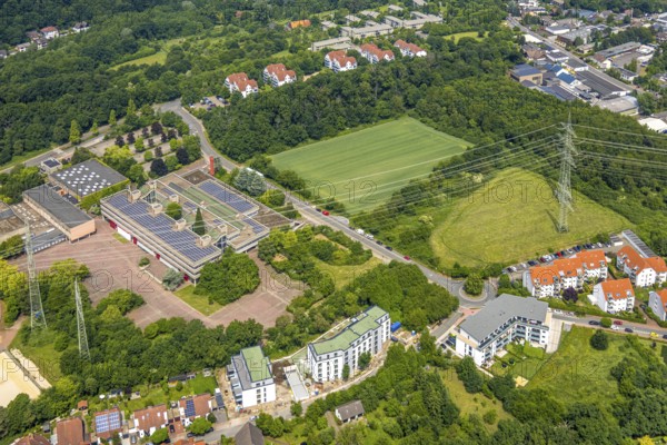 Aerial view, Gymnasium Holthausen Lindstockstraße with solar panels, open space and green area next to the school centre, planned construction of a special school plus new indoor swimming pool, new residential complex, Hattingen, Ruhr area, North Rhine-Westphalia, Germany, construction area, education, educational institution, DE, Europe, photovoltaics, property tax, grammar school, real estate, educational institute, aerial view, aerial photography, aerial photography, photovoltaic system, school, solar system, solar roof, solar energy, solar panels, solar power system, overview, bird's-eye view, residential complex, housing and living, residential area, residential quality, residential neighbourhood, housing estate, residential district, birds-eyes view, overview