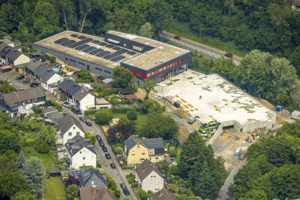 Aerial view, construction site new building Rewe supermarket Denkmalstraße, roof with solar panels, Hattingen, Ruhr area, North Rhine-Westphalia, Germany, construction work, construction area, building site, building plots, construction project, construction site, DE, shopping centre, Europe, photovoltaic, aerial view, aerial photography, aerial photography, local supply centre, new building, photovoltaic plant, solar, solar plant, solar roof, solar energy, solar panels, solar panels, solar power plant, supermarket, overview, bird's-eye view, overview