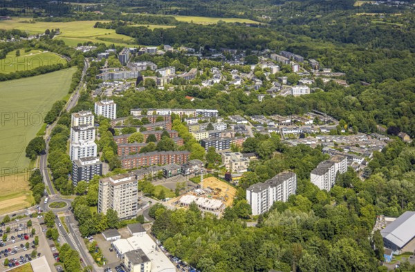 Aerial view, high-rise buildings and apartment blocks on Rhönstraße, construction site with new building on Europaplatz for apartment blocks, Oberilp, Heiligenhaus, Ruhr area, North Rhine-Westphalia, Germany, construction work, construction area, construction site, building plots, construction project, construction project, construction site, DE, Europe, property tax, real estate, aerial view, aerial photography, aerial photography, new building, overview, bird's-eye view, residential complex, living and living, residential area, residential quality, residential neighbourhood, residential estate, residential district, birds-eyes view, overview