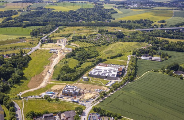 Aerial photo, construction site and new construction Innovation Park Heiligenhaus, roof with solar panels, Heiligenhaus, Ruhr area, North Rhine-Westphalia, Germany, construction work, construction area, building site, building plots, construction measure, construction project, construction site, DE, Europe, photovoltaics, commercial enterprises, commercial area, industrial estate, commercial property, commercial park, commercial site, commercial use, industrial area, industrial site, aerial view, aerial photography, aerial photography, new construction, photovoltaic plant, solar, solar plant, solar roof, solar energy, solar panels, solar power plant, overview, bird's eye view, birds-eyes view, overview
