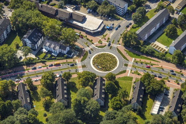 Aerial view, road traffic and planted roundabout Horster Straße and Wiesmannstraße, red marked cycle path, Gladbeck lettering in colourful capital letters with sculpture Alwine, Brauck, Gladbeck, Ruhr area, North Rhine-Westphalia, Germany
