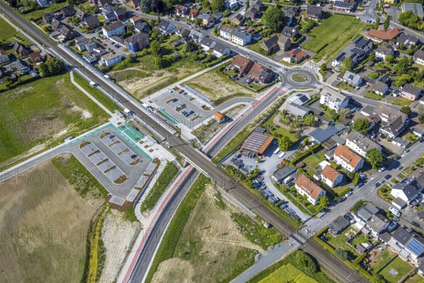 Aerial view, planned local transport connection with stop in Westtünnen, construction site at Südfeldweg and Von-Thünen-Straße for the future railway stop, railway line with railway bridge, car parks, Rhynern district, Hamm, Ruhr area, North Rhine-Westphalia, Germany