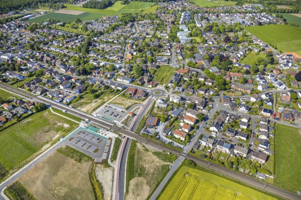 Aerial view, planned local transport connection with stop in Westtünnen, construction site at Südfeldweg and Von-Thünen-Straße for the future railway stop, railway line with railway bridge, car parks, Rhynern district, Hamm, Ruhr area, North Rhine-Westphalia, Germany