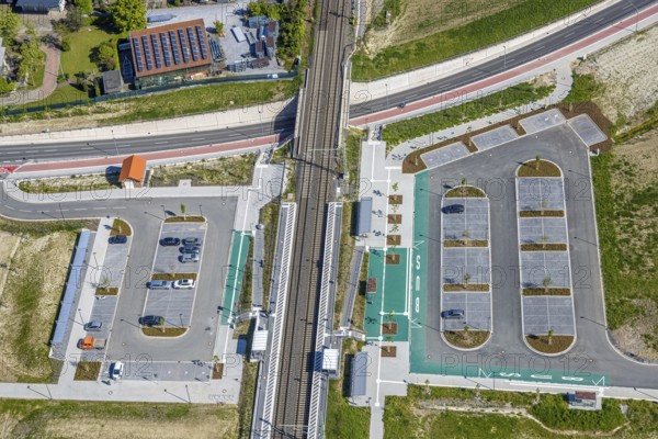 Aerial view, planned local transport connection with stop in Westtünnen, construction site at Südfeldweg and Von-Thünen-Straße for the future railway stop, railway line with railway bridge, car parks, Rhynern district, Hamm, Ruhr area, North Rhine-Westphalia, Germany