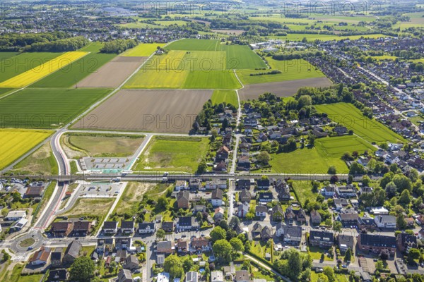 Aerial view, planned local transport connection with stop in Westtünnen, construction site at Südfeldweg and Von-Thünen-Straße for the future railway stop, railway line with railway bridge, car parks, Rhynern district, Hamm, Ruhr area, North Rhine-Westphalia, Germany