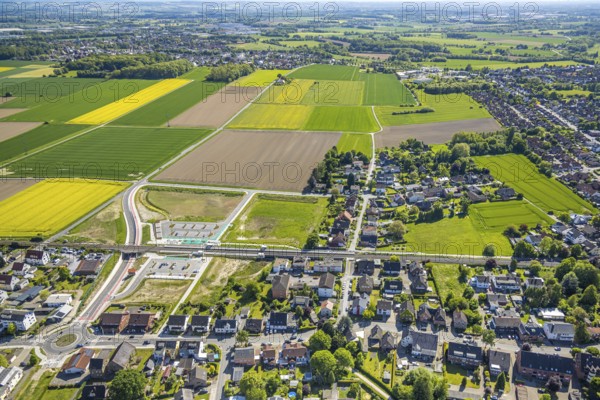 Aerial view, planned local transport connection with stop in Westtünnen, construction site at Südfeldweg and Von-Thünen-Straße for the future railway stop, railway line with railway bridge, car parks, Rhynern district, Hamm, Ruhr area, North Rhine-Westphalia, Germany