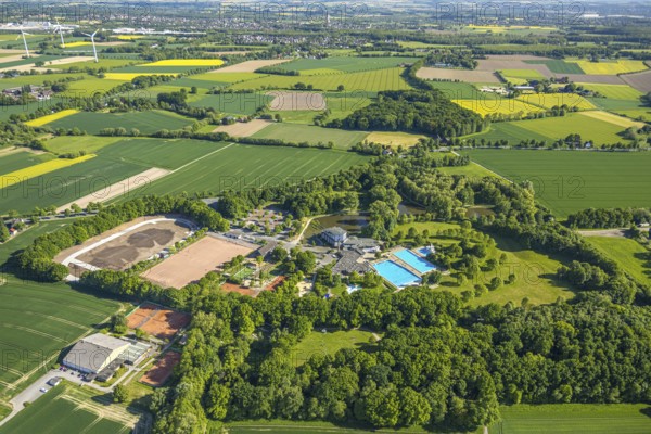 Aerial view, outdoor swimming pool Selbachpark at Hotel Selbachpark, Selbachpark sports facilities renovation and refurbishment, distant view with meadows and fields, Pelkum district, Hamm, Ruhr area, North Rhine-Westphalia, Germany