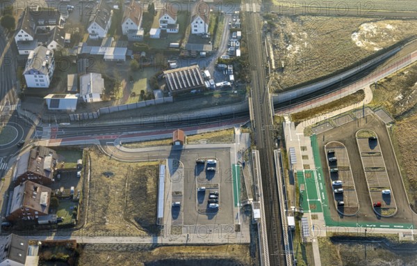 Aerial view, planned local transport connection with stop in Westtünnen, construction site on Südfeldweg and Von-Thünen-Straße for the future railway stop, railway line with railway bridge and housing estate with roundabout, car parks, Rhynern district, Hamm, Ruhr area, North Rhine-Westphalia, Germany