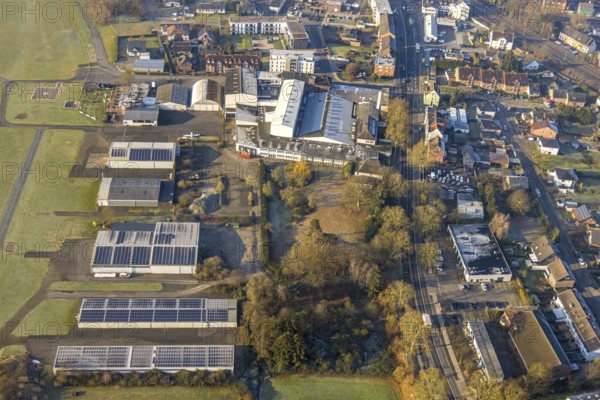 Aerial view, residential area Heessener Straße from Seeburger Straße to An der Mattenbecke with Basic Fit fitness centre and ruins of the car wash, opposite planned building for Bildungszentrum Nord, Heessen district, Hamm, Ruhr area, North Rhine-Westphalia, Germany