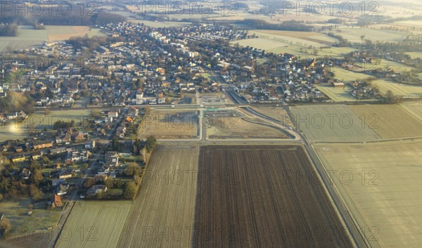 Aerial view, planned local transport connection with stop in Westtünnen, Südfeldweg, construction site on Südfeldweg and Von-Thünen-Straße for the future railway stop, railway line with railway bridge and housing estate with roundabout, car parks, Rhynern district, Hamm, Ruhr area, North Rhine-Westphalia, Germany