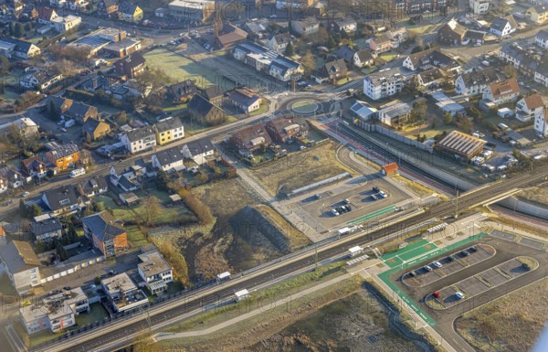 Aerial view, planned local transport connection with stop in Westtünnen, construction site on Südfeldweg and Von-Thünen-Straße for the future railway stop, railway line with railway bridge and housing estate with roundabout, car parks, Rhynern district, Hamm, Ruhr area, North Rhine-Westphalia, Germany