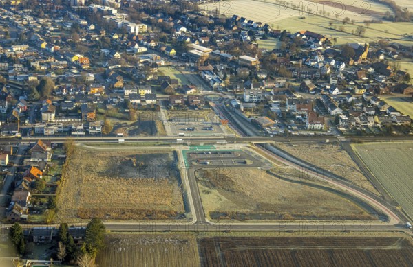 Aerial view, planned local transport connection with stop in Westtünnen, construction site on Südfeldweg and Von-Thünen-Straße for the future railway stop, railway line with railway bridge and housing estate with roundabout, car parks, Rhynern district, Hamm, Ruhr area, North Rhine-Westphalia, Germany