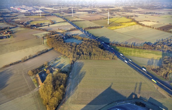 Aerial view, motorway A2, meadows and fields with wind turbines, distant view to the industrial area Weetfelder Straße, haze, district Rhynern, Hamm, Ruhr area, North Rhine-Westphalia, Germany