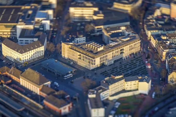 ATTENTION Photos with partial blurring caused by tilt technique on the lens side, aerial view, station forecourt Platz der Deutschen Einheit with VHS, city library and Heinrich-von-Kleist-Forum, centre, Hamm, Ruhr area, North Rhine-Westphalia, Germany
