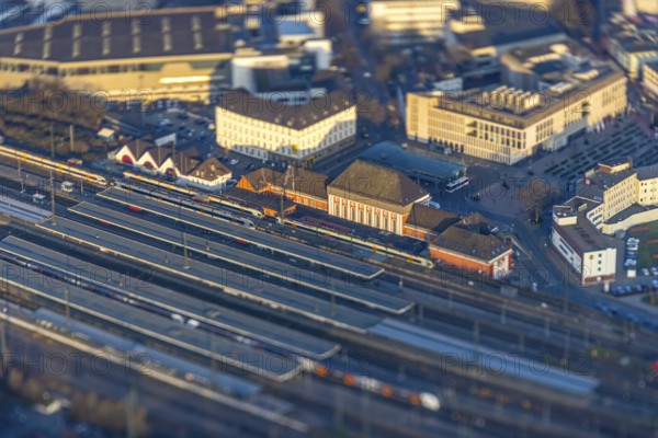 ATTENTION Photos with partial blurring created by tilt technique on the lens side, aerial view, main station Hbf and station forecourt with ZOB bus station, centre, Hamm, Ruhr area, North Rhine-Westphalia, Germany