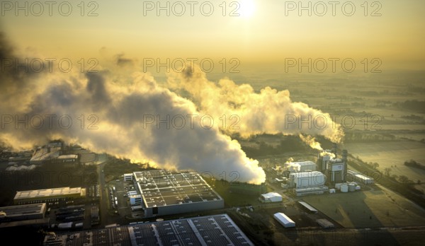 Aerial view, Trianel gas-fired power plant GuD Hamm power supply company with clouds of smoke against the light, Uentrop, Picnic factory building with solar roof, Hamm, Ruhr area, North Rhine-Westphalia, Germany