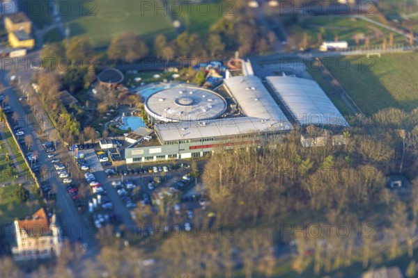 ATTENTION Photos with partial blurring caused by tilt technique on the lens side, aerial view, MAXIMARE adventure pool and wellness pool with indoor pool, centre, Hamm, Ruhr area, North Rhine-Westphalia, Germany