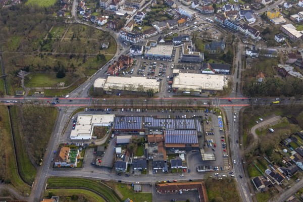 Aerial view, Dortmunder Straße shopping centre with DM, Rewe, Aldi and Edeka supermarket, St. Victor's Church, construction site with new building, Herringen market and town centre, Herringen district, Hamm, Ruhr area, North Rhine-Westphalia, Germany