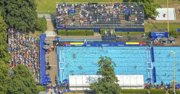 Aerial view, sports park with outdoor swimming pool swimming stadium ASC Dusiburg at Kruppstraße, water polo competition with spectators on stands, World Student Games FISU World University Games 2025, Rhine-Ruhr 2025, Neudorf, Duisburg, Ruhr area, North Rhine-Westphalia, Germany, bathing establishment, bathing resort, DE, Europe, outdoor swimming pool, aerial view, aerial photography, aerial photography, swimming pool, swimming pool, sports, overview, bird's eye view, birds-eyes view, overview
