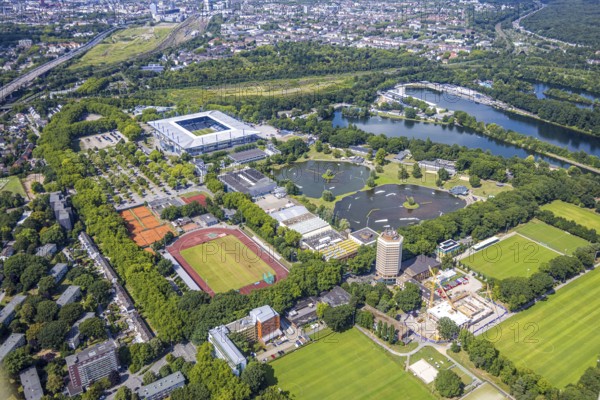 Aerial view, Duisburg-Süd, sports park with Schauinsland-Reisen-Arena, also Wedau-Stadion, Margaretensee with water ski and wakeboard facility, sports school Wedau with construction site and high-rise building, on the right the regatta course, Neudorf, Duisburg, Ruhr area, North Rhine-Westphalia, Germany, architecture, trees, stage, DE, Europe, leisure, building, infrastructure, culture, landscape, aerial view, aerial photography, aerial photography, outdoor, park, audience, regatta course, Schauinsland-Reisen-Arena, summer, sport, sports park, stadium, overview, bird's eye view, Wedau-Stadion, spectator, birds-eyes view, european, overview