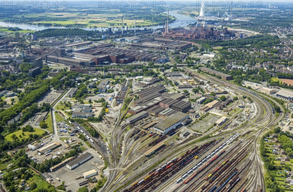 Aerial view, reserve parts centre Duisburg thyssenkrupp Steel Europe AG and goods station, rear thyssenkrupp Steel Europe AG plant, Marxloh, Duisburg, Ruhr area, North Rhine-Westphalia, Germany, railway area, DE, Europe, commercial enterprises, commercial area, commercial property, commercial site, commercial use, railway tracks, tracks, industrial area, industrial site, aerial view, aerial photography, aerial photography, aerial photography, overview, bird's-eye view, birds-eyes view, overview