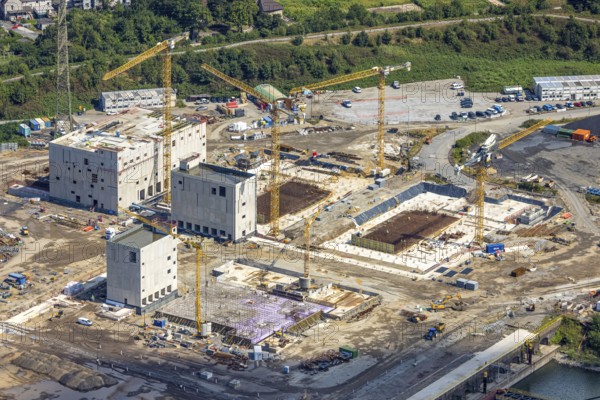 Aerial view, construction site with new construction of electrical switching houses for direct reduction plant next to the south harbour Walsum, Fahrn, Duisburg, Ruhr area, North Rhine-Westphalia, Germany, construction work, construction area, construction site, building plots, construction project, construction site, DE, DR plant, Europe, large construction site, aerial photograph, aerial photography, aerial photography, new construction, overview, bird's-eye view, bird's-eye view, overview