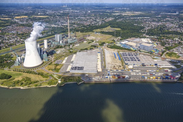 Aerial view, logport VI (six) Walsum, industrial estate and construction site with new building at the STEAG Walsum power station on the Rhine, steaming cooling tower, Alt-Walsum, Duisburg, Ruhr area, North Rhine-Westphalia, Germany, construction work, construction area, construction site, building land, construction project, construction site, DE, Duisburg-Nord, Europe, commercial enterprises, commercial area, commercial area, commercial property, business park, commercial location, commercial use, large construction site, freight transport, combined heat and power plant, industrial area, industrial location, power plant, logistics, logistics service, logistics service provider, logistics provider, logistics centre, aerial view, aerial photography, aerial photography, new construction, transport service, overview, bird's eye view, birds-eyes view, logport 6 (Six), logport VI Walsum, multimodal logistics centre, overview