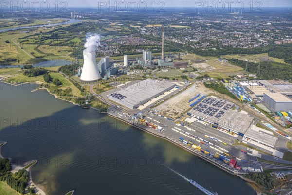 Aerial view, logport VI (six) Walsum, industrial estate and construction site with new building at the STEAG Walsum power station on the Rhine, steaming cooling tower, Alt-Walsum, Duisburg, Ruhr area, North Rhine-Westphalia, Germany, construction work, construction area, construction site, building land, construction project, construction site, DE, Duisburg-Nord, Europe, commercial enterprises, commercial area, commercial area, commercial property, business park, commercial location, commercial use, large construction site, freight transport, combined heat and power plant, industrial area, industrial location, power plant, logistics, logistics service, logistics service provider, logistics provider, logistics centre, aerial view, aerial photography, aerial photography, new construction, transport service, overview, bird's eye view, birds-eyes view, logport 6 (Six), logport VI Walsum, multimodal logistics centre, overview