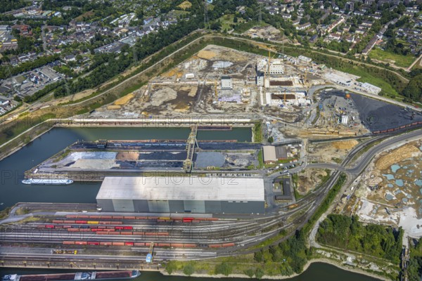 Aerial view, construction site with new construction of electrical switching houses for direct reduction plant next to the south harbour Walsum, Fahrn, Duisburg, Ruhr area, North Rhine-Westphalia, Germany, construction work, construction area, construction site, building plots, construction project, construction site, DE, DR plant, Europe, large construction site, aerial photograph, aerial photography, aerial photography, new construction, overview, bird's-eye view, bird's-eye view, overview
