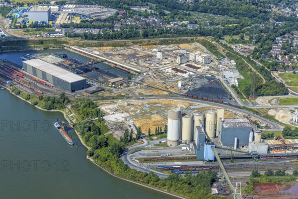 Aerial view, construction site with new construction of electrical switching houses for direct reduction plant next to the south harbour Walsum, in front Holcim Westcement concrete plant, Fahrn, Duisburg, Ruhr area, North Rhine-Westphalia, Germany, construction work, construction area, construction site, construction site, construction project, construction site, DE, Europe, large construction site, aerial view, aerial photography, aerial photography, new construction, overview, bird's-eye view, overview