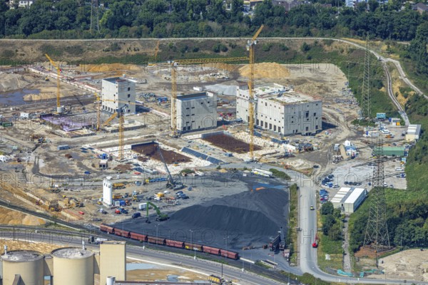 Aerial view, construction site with new construction of electrical switching houses for direct reduction plant next to the south harbour Walsum, Fahrn, Duisburg, Ruhr area, North Rhine-Westphalia, Germany, construction work, construction area, construction site, building plots, construction project, construction site, DE, DR plant, Europe, large construction site, aerial photograph, aerial photography, aerial photography, new construction, overview, bird's-eye view, bird's-eye view, overview
