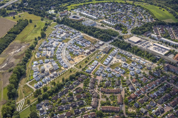 Aerial view, Duisburg-Süd, residential area Angerbogen, Am Alten Angerbach, semi-circular new housing estate, commercial area Xella International GmbH and Edeka E-Center Angerbogen, roofed railway station Angerbogen, behind the Rahmer See, Huckingen, Duisburg, Ruhr area, North Rhine-Westphalia, Germany, Ruh
