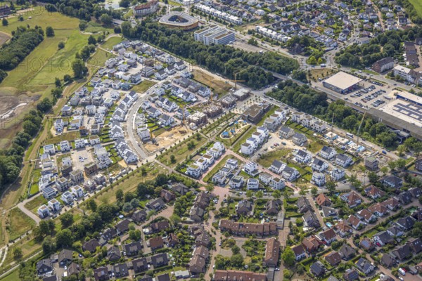 Aerial view, Duisburg-Süd, residential area Angerbogen, Am Alten Angerbach, semi-circular new housing estate, commercial area Xella International GmbH and Edeka E-Center Angerbogen, roofed railway station Angerbogen, behind the Rahmer See, Huckingen, Duisburg, Ruhr area, North Rhine-Westphalia, Germany, Ruh