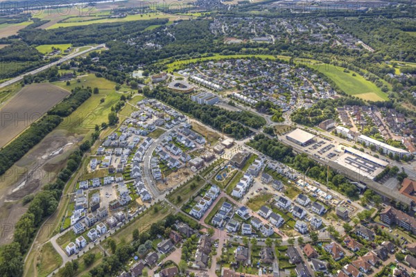 Aerial view, Duisburg-Süd, residential area Angerbogen, Am Alten Angerbach, semi-circular new housing estate, commercial area Xella International GmbH and Edeka E-Center Angerbogen, roofed railway station Angerbogen, behind the Rahmer See, Huckingen, Duisburg, Ruhr area, North Rhine-Westphalia, Germany, Ruh