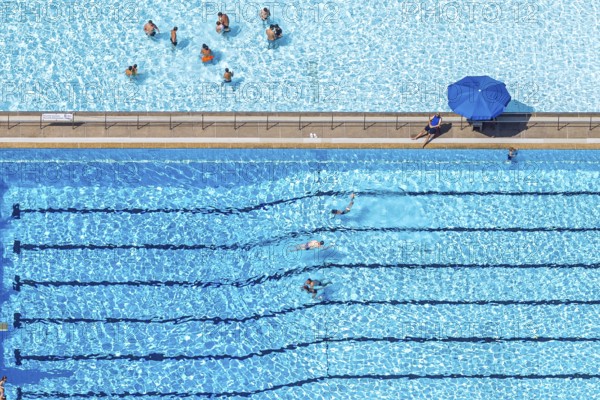 Aerial view, outdoor swimming pool Homberg with swimming pool and bathers, lifeguard with parasol at the edge of the pool, Alt-Homberg, Duisburg, Ruhr area, North Rhine-Westphalia, Germany, bathing establishment, bathing resort, DE, Europe, outdoor swimming pool, leisure activities, aerial view, aerial photography, aerial photography, swimming pool, swimming pool, overview, bird's-eye view, overview