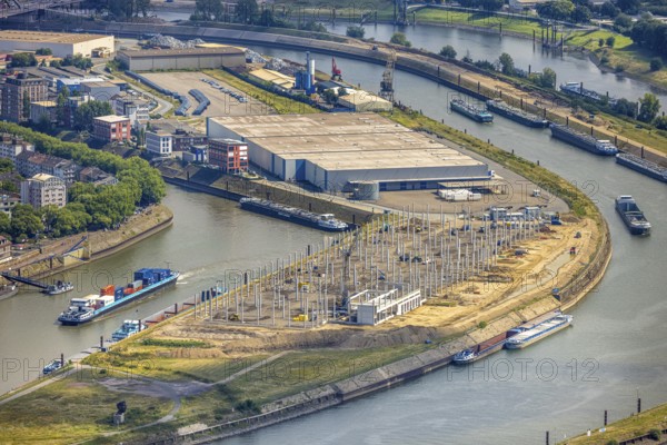 Aerial view, Mercatorinsel inland navigation on Vinckekanal and harbour canal, Stangenwald construction site with new logistics hall, Ruhrort, Duisburg, Ruhr area, North Rhine-Westphalia, Germany, construction work, construction area, building site, building plots, construction project, construction site, DE, Europe, harbour, aerial view, aerial photography, aerial photography, Mercator Island, new construction, overview, bird's-eye view, overview